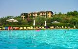 Garda holiday apartment rental with shared pool, golf, beach/lake nearby, balcony/terrace, rural retreat, TV