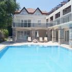 Ground floor apartment, patio, pool with free transfers to private beach